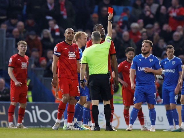Leyton Orient's Omar Beckles is shown a red card by referee Carl Brook on April 18, 2023