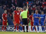Leyton Orient's Omar Beckles is shown a red card by referee Carl Brook on April 18, 2023