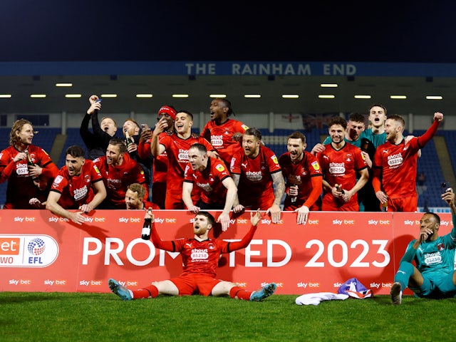 Leyton Orient players celebrate after winning promotion to League One on April 18, 2023