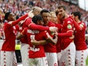 Mainz 05's Ludovic Ajorque celebrates scoring their first goal with teammates on April 22, 2023