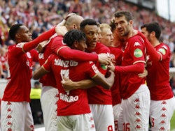 Mainz 05's Ludovic Ajorque celebrates scoring their first goal with teammates on April 22, 2023