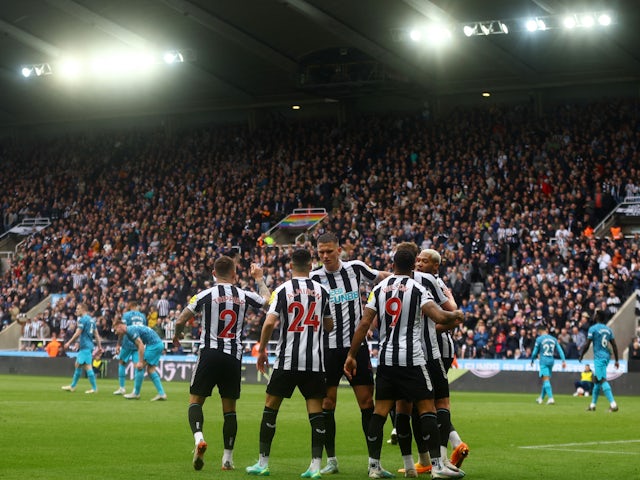 Newcastle United's Callum Wilson celebrates scoring their sixth goal with teammates on April 23, 2023