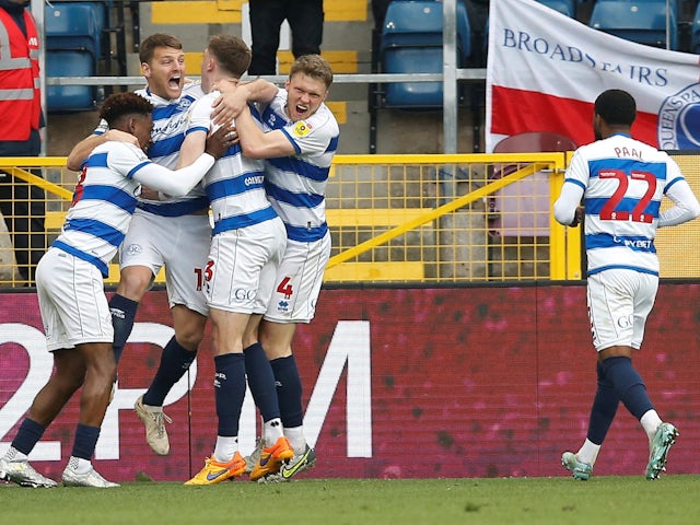 Queens Park Rangers' Chris Martin celebrates scoring their second goal with teammates on April 22, 2023