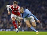 Arsenal's Rob Holding in action with Manchester City's Erling Braut Haaland on January 27, 2023