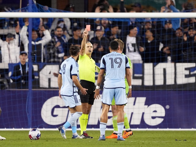 Sporting Kansas City defender Robert Castellanos (19) receives a red card from referee Tim Ford on April 16, 2023