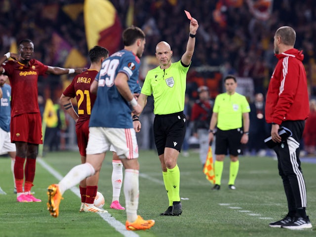 Feyenoord's Santiago Gimenez is shown a red card by referee Anthony Taylor on April 20, 2023