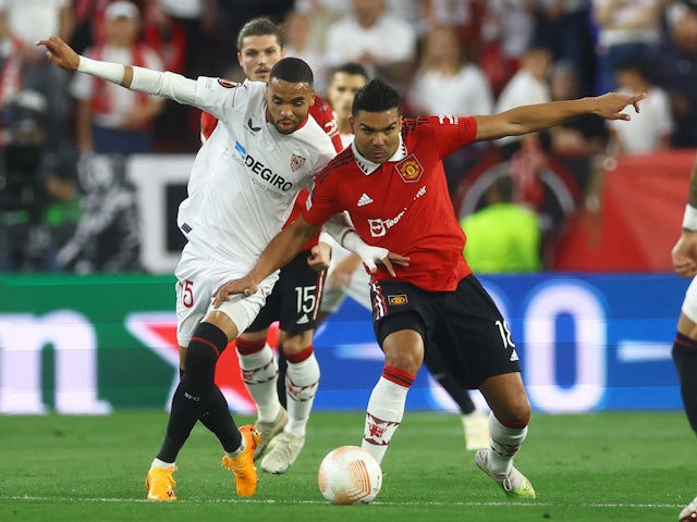 Sevilla's Youssef En-Nesyri in action with Manchester United's Casemiro on April 20, 2023