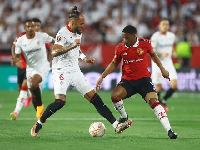 Sevilla's Nemanja Gudelj in action with Manchester United's Anthony Martial on April 20, 2023
