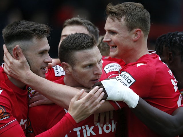 Wrexham celebrate a goal against Boreham Wood on their way to promotion on April 22, 2023.