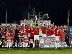 Wrexham's Luke Young lifts the trophy as they celebrate winning the National League and promotion to League Two on April 22, 2023
