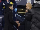 Arsenal manager Mikel Arteta shakes hands with Manchester City manager Pep Guardiola before the match on January 27, 2023