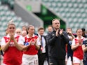 Arsenal Women manager Jonas Eidevall claps the fans with players on April 23, 2023