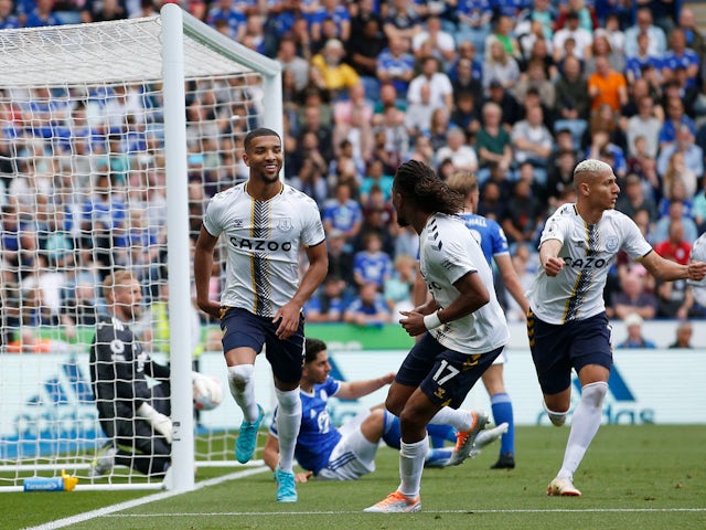 Everton's Mason Holgate celebrates scoring their second goal with Alex Iwobi and Richarlison on May 8, 2022