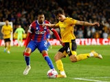 Crystal Palace's Michael Olise in action with Wolverhampton Wanderers' Hugo Bueno on April 25, 2023