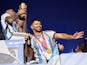 Argentina's Sergio Aguero celebrates on a bus with the World Cup trophy on December 19, 2022
