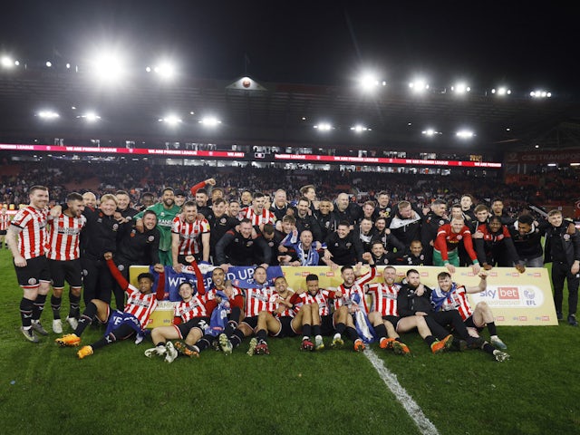 Sheffield United's players celebrate promotion to the Premier League after the match on April 26, 2023
