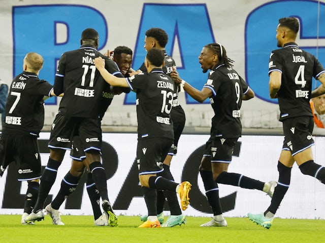 Auxerre's Birama Toure celebrates scoring their first goal with teammates on April 30, 2023