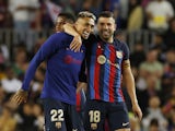 Barcelona's Raphinha and Jordi Alba celebrate after the match on May 2, 2023