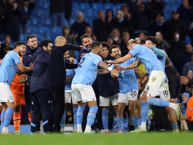 Manchester City's Erling Braut Haaland receives a guard of honour from teammates and manager Pep Guardiola at the end of the match after breaking the record for most goals scored in a single Premier League season on May 3, 2023