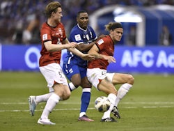 Al-Hilal's Odion Ighalo in action with Urawa Red Diamonds' Alexander Scholz and Marius Hoibraaten on April 29, 2023