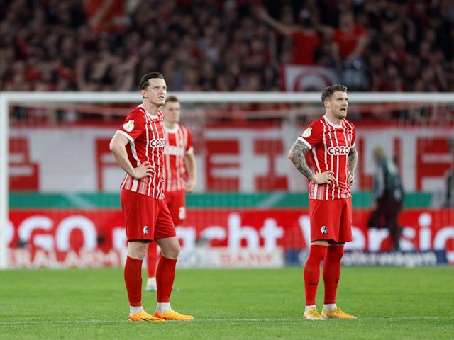 Freiburg's Michael Gregoritsch with teammates react after RB Leipzig scored their third goal on May 2, 2023