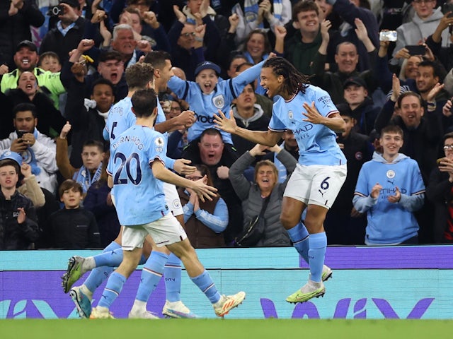 Manchester City's Nathan Ake celebrates scoring against West Ham United on May 3, 2023