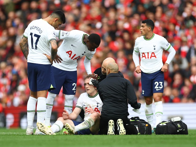 Tottenham Hotspur's Oliver Skipp receives treatment for an injury on April 30, 2023