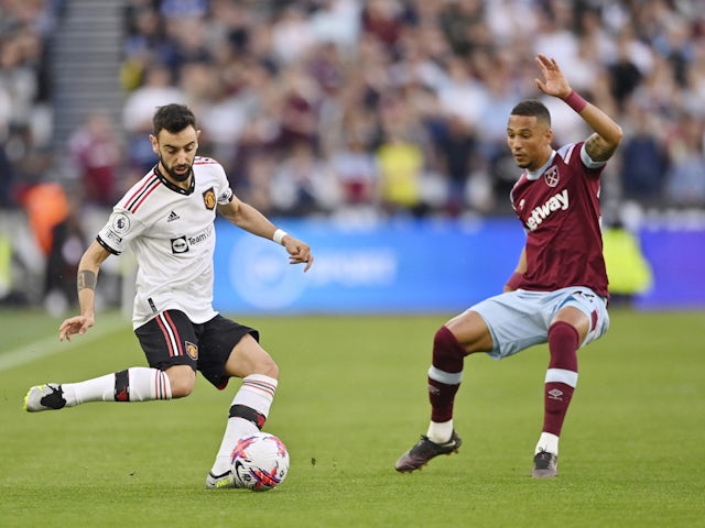 Manchester United's Bruno Fernandes in action with West Ham United's Thilo Kehrer on May 7, 2023
