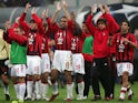 AC Milan's players wave to supporters after the match against Inter Milan in their Champions League quarter-final second leg was abandoned in Milan on April 12, 2005
