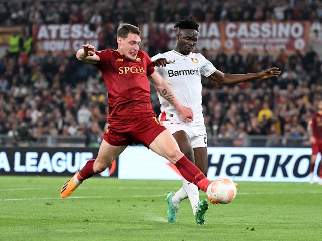 Roma's Andrea Belotti in action with Bayer Leverkusen's Odilon Kossounou on May 11, 2023
