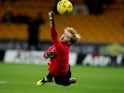 Liverpool goalkeeper Caoimhin Kelleher warms up in January 2023