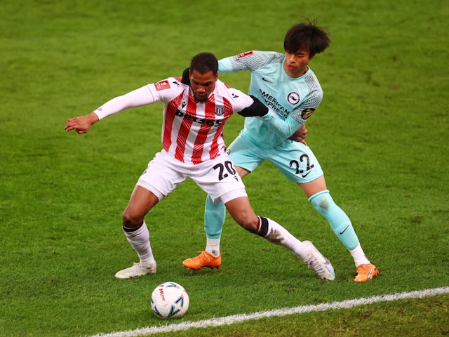Stoke City's Dujon Sterling in action with Brighton & Hove Albion's Kaoru Mitoma on February 28, 2023