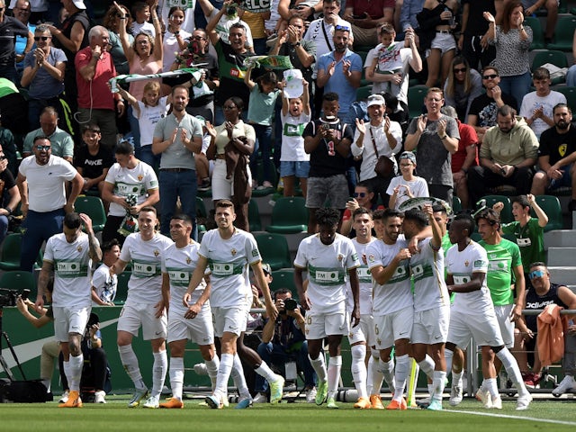 Elche's Fidel celebrates scoring their first goal with teammates on May 14, 2023