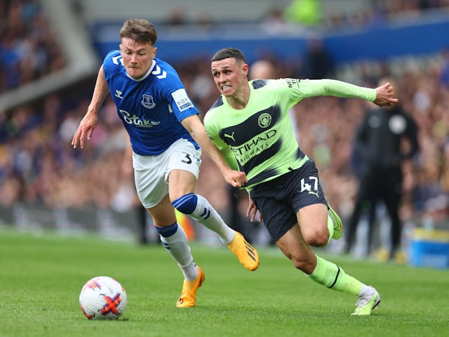 Manchester City's Phil Foden in action with Everton's Nathan Patterson on May 14, 2023
