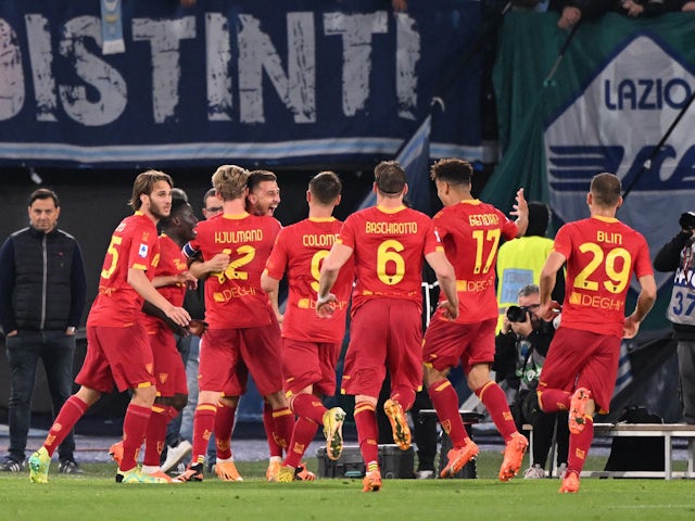 Lecce's Remi Oudin celebrates scoring their first goal with teammates on May 12, 2023
