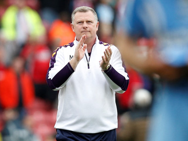 Coventry City manager Mark Robins applauds fans after the match on May 8, 2023