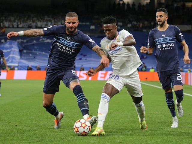 Real Madrid's Vinicius Junior in action with Manchester City's Kyle Walker on May 4, 2022