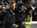 Los Angeles FC forward Yekeson Subah (center) is helped to the locker room after a message board fell on his legs on May 9, 2023