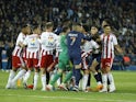Players clash from both teams before AC Ajaccio's Thomas Mangani and Paris Saint-Germain's (PSG) Achraf Hakimi are both are sent off on May 13, 2023