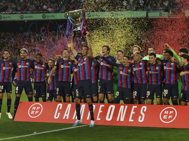 Barcelona players celebrate winning the La Liga title on May 20, 2023