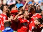 Barnsley's Nicky Cadden celebrates scoring their first goal with teammates on May 13, 2023
