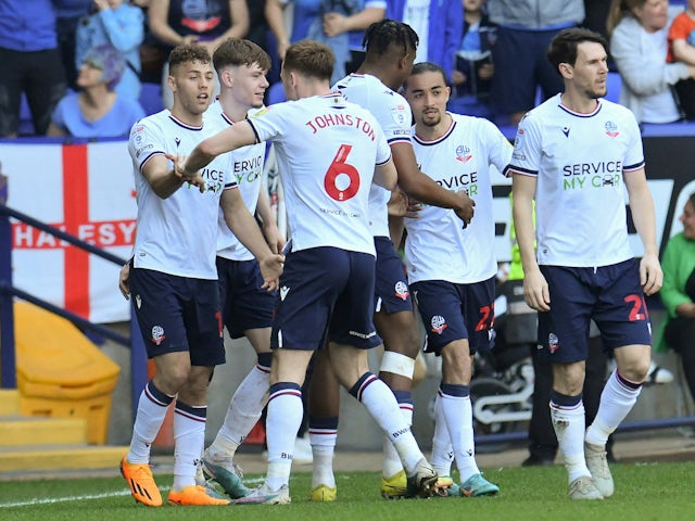 Bolton Wanderers' Dion Charles celebrates scoring their first goal with teammates on May 13, 2023