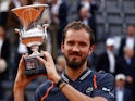 Daniil Medvedev poses with the trophy after winning the Italian Open on May 21, 2023