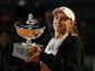 Elena Rybakina poses with the trophy after winning the Italian Open on May 20, 2023