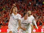 Sevilla's Erik Lamela celebrates scoring their second goal with Bryan Gil and Youssef En-Nesyri on May 18, 2023