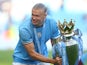 Manchester City's Erling Braut Haaland celebrates with the trophy after winning the Premier League on May 21, 2023