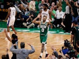  Boston Celtics forward Jayson Tatum (0) signals 50 after hitting a three point basket to put him over 50 points for the game against the Philadelphia 76ers on May 14, 2023