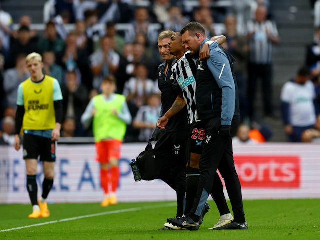 Newcastle United's Joe Willock is taken off after sustaining an injury on May 20, 2023