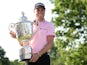 Justin Thomas poses with the Wanamaker trophy after winning the PGA Championship golf tournament at Southern Hills Country Club on May 22, 2022
