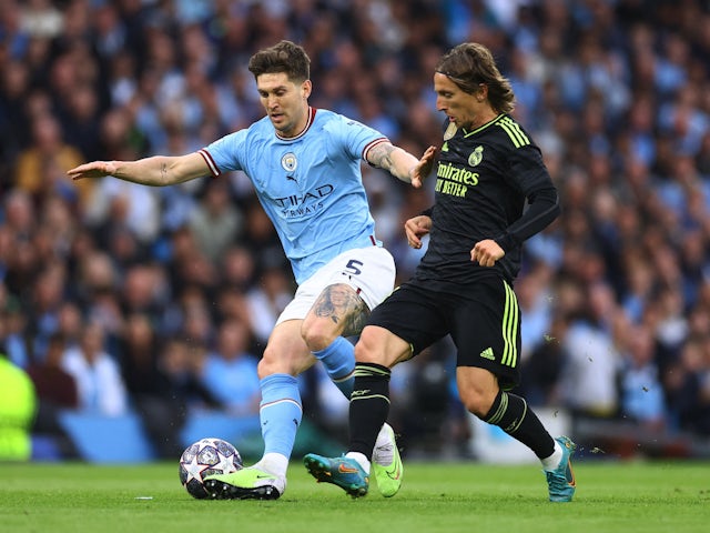 Manchester City's John Stones in action with Real Madrid's Luka Modric on May 17, 2023